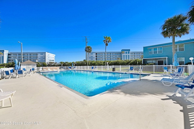 view of swimming pool featuring a patio area