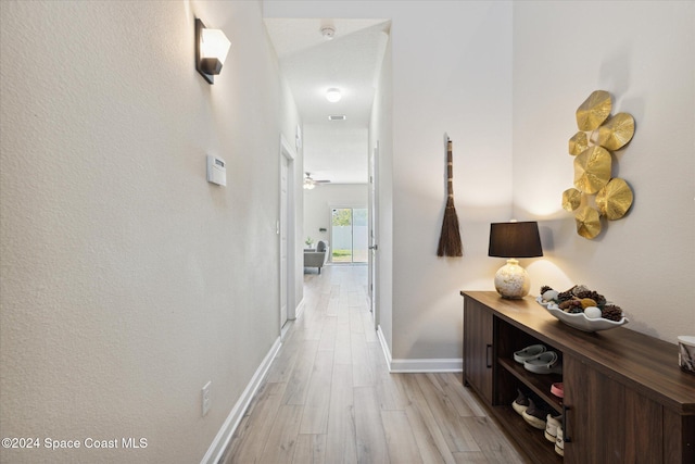 hall with light hardwood / wood-style floors