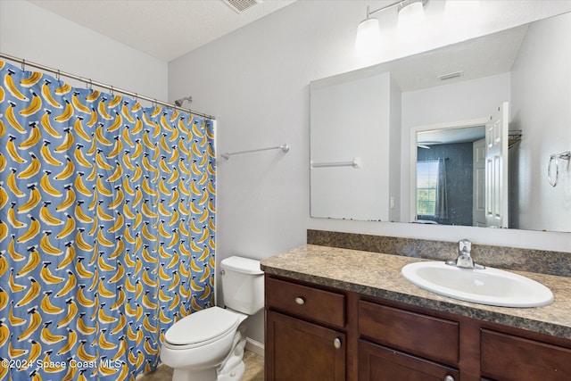 bathroom featuring a shower with shower curtain, vanity, toilet, and a textured ceiling