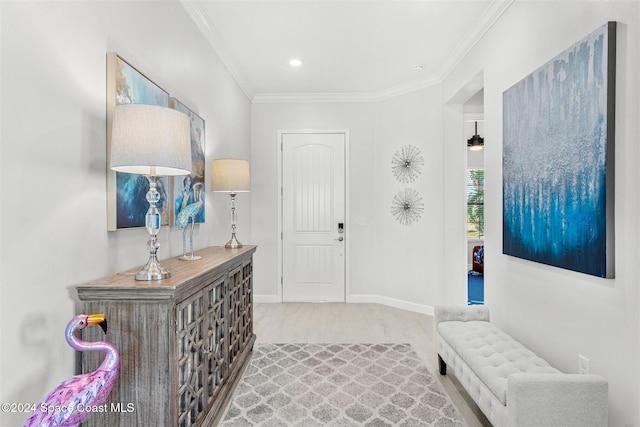 entrance foyer featuring recessed lighting, baseboards, and ornamental molding