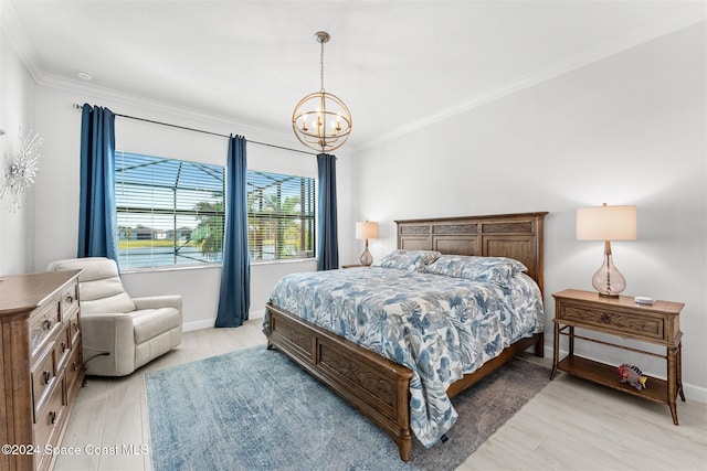 bedroom featuring a notable chandelier, light wood-type flooring, crown molding, and baseboards