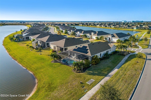 bird's eye view featuring a residential view and a water view