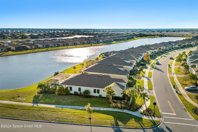 bird's eye view with a residential view and a water view