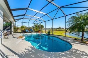 outdoor pool featuring a patio and a lanai