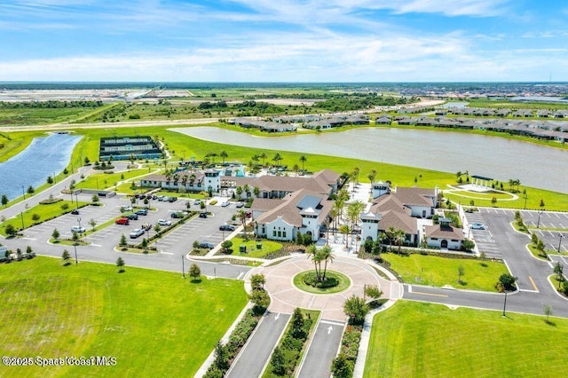 birds eye view of property with a water view and a residential view