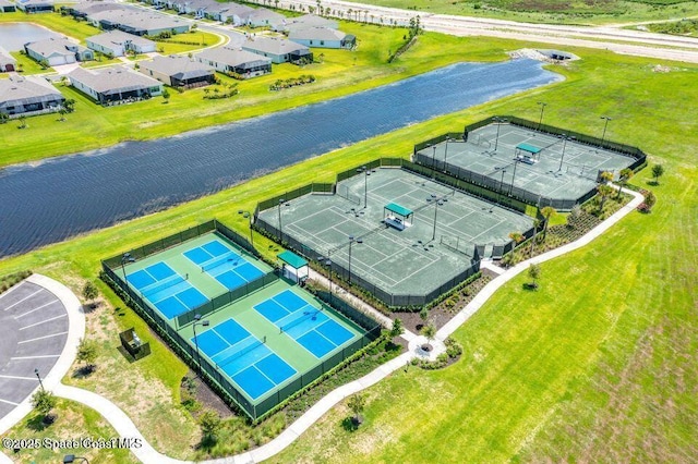 birds eye view of property featuring a water view