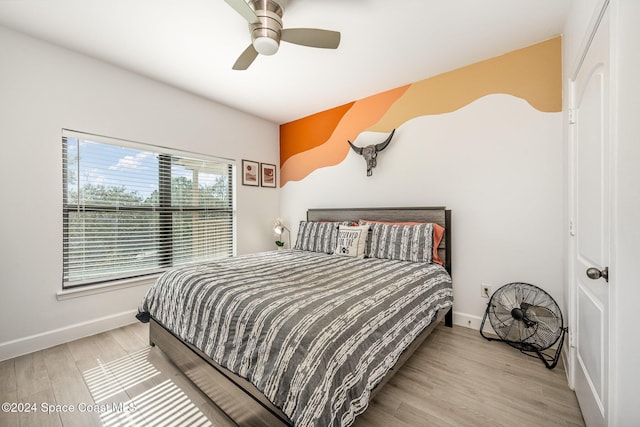 bedroom featuring ceiling fan and light wood-type flooring