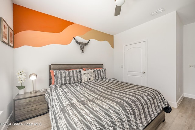 bedroom with ceiling fan and light wood-type flooring