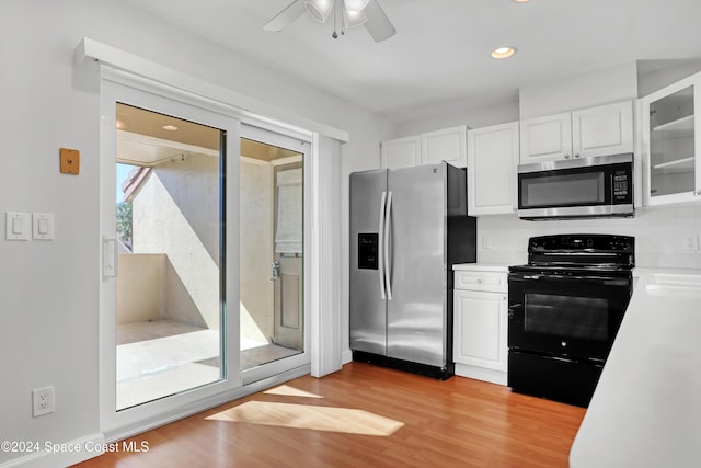 kitchen featuring tasteful backsplash, stainless steel appliances, ceiling fan, light hardwood / wood-style flooring, and white cabinets