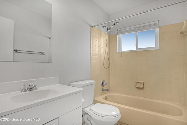 full bathroom with toilet, vanity, and tiled shower / bath