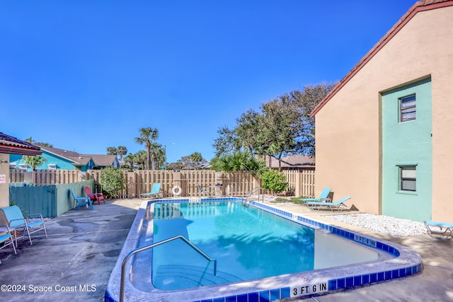 view of pool featuring a patio