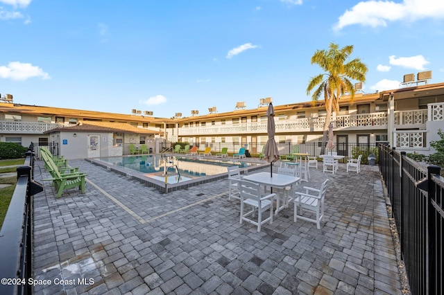 view of patio featuring a community pool