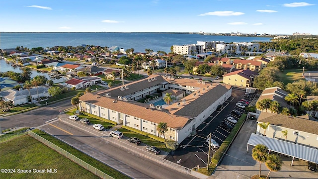 birds eye view of property featuring a water view