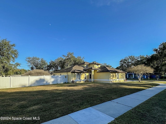 view of front of house with a front lawn