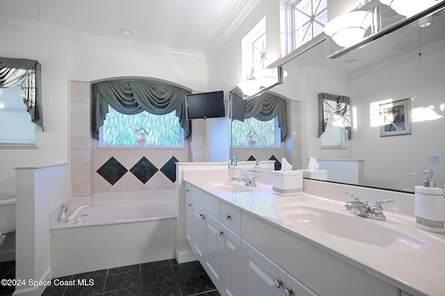 bathroom with vanity, a tub to relax in, and ornamental molding