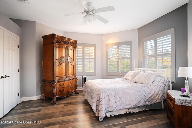 bedroom featuring ceiling fan and dark wood-type flooring