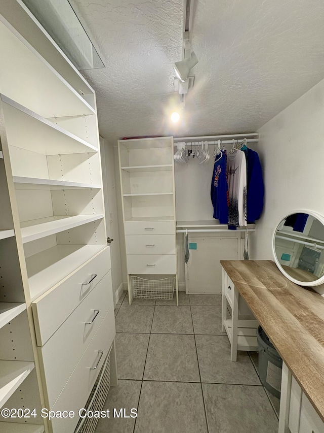 walk in closet featuring light tile patterned floors