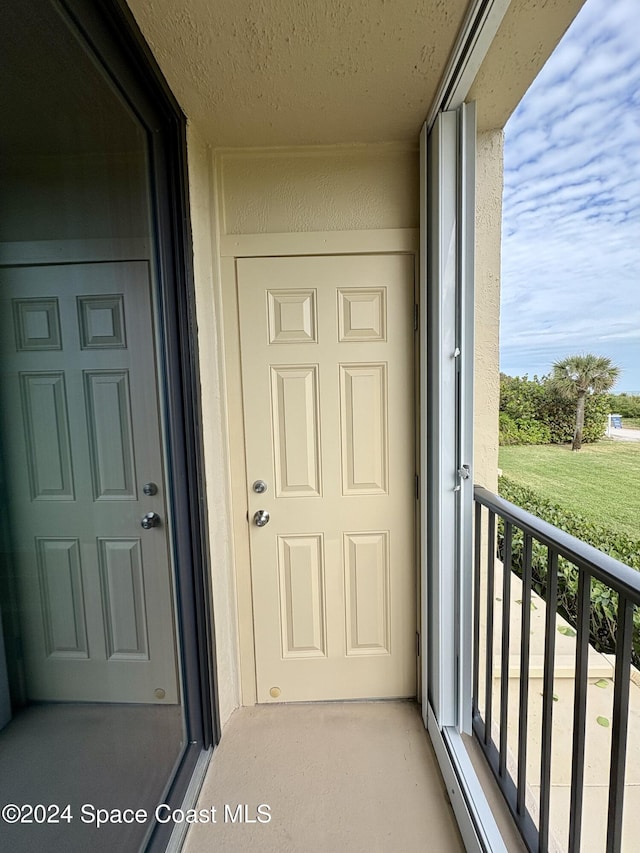 property entrance with a balcony