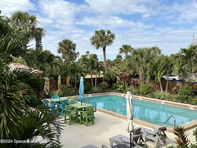 view of swimming pool featuring a patio area