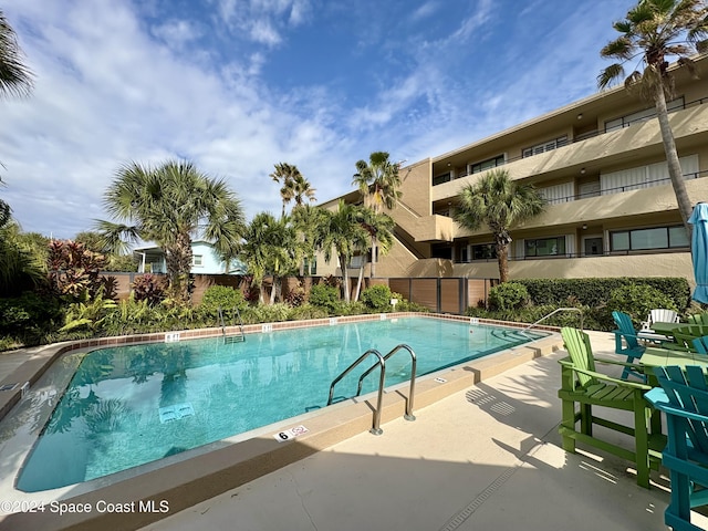 view of swimming pool featuring a patio area