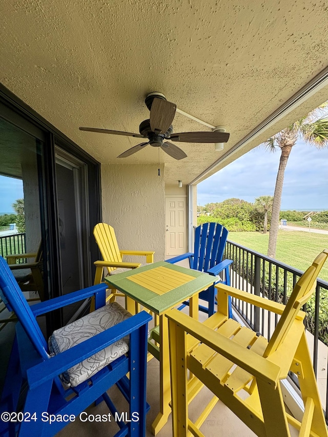 balcony featuring ceiling fan