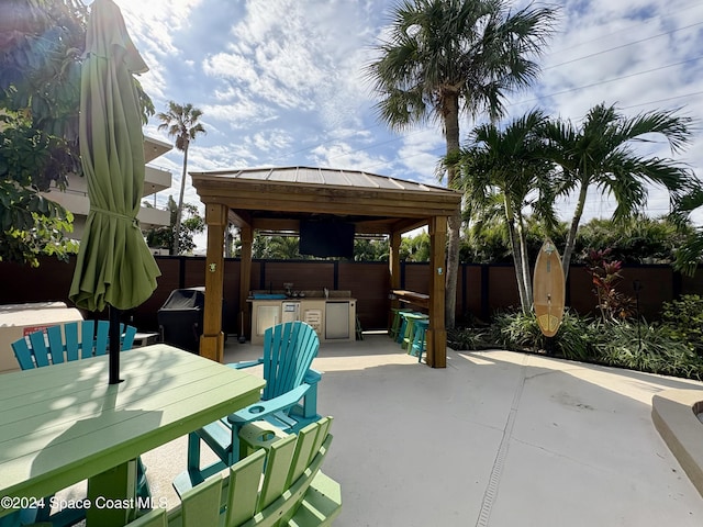 view of patio / terrace featuring a gazebo and exterior kitchen