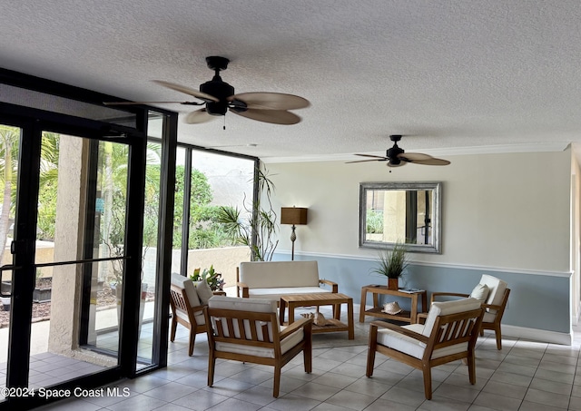 sunroom featuring ceiling fan