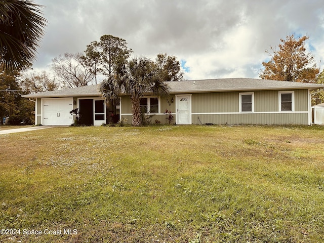 ranch-style house with a front lawn and a garage