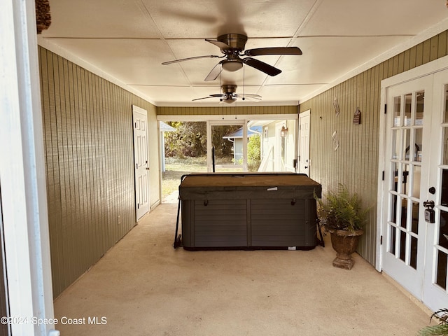 sunroom featuring french doors and ceiling fan