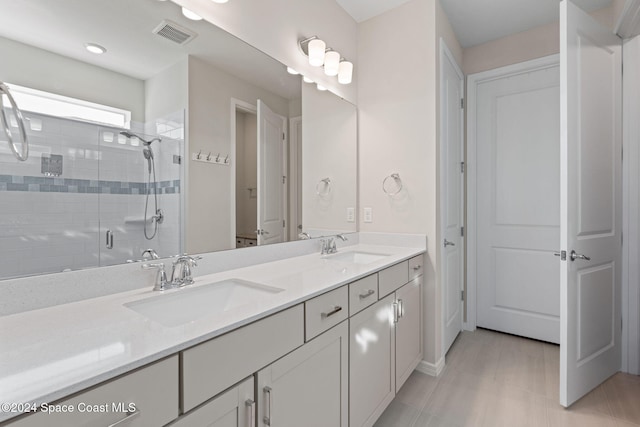 bathroom with vanity and walk in shower