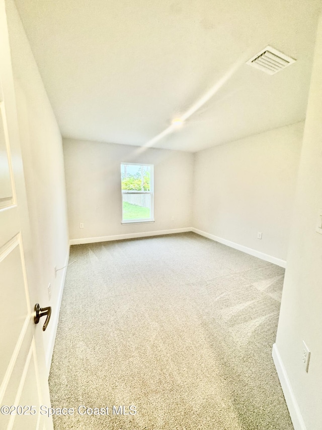 725 De Groodt Rd SW, Palm Bay, FL 32908 - spare room with carpet and baseboards