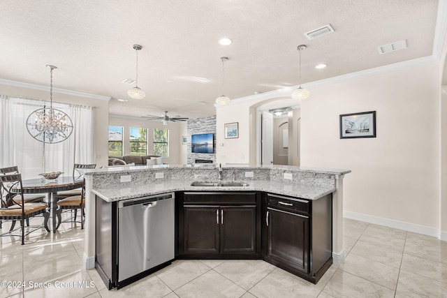 kitchen with dishwasher, ceiling fan with notable chandelier, sink, and decorative light fixtures