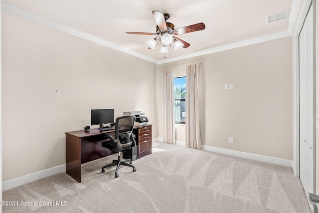 carpeted home office featuring ceiling fan and ornamental molding