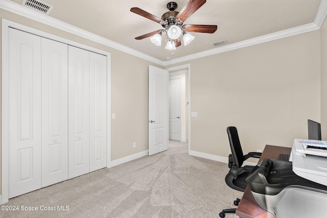 unfurnished office featuring light colored carpet, ceiling fan, and crown molding