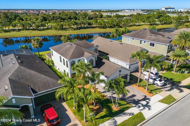 birds eye view of property with a water view