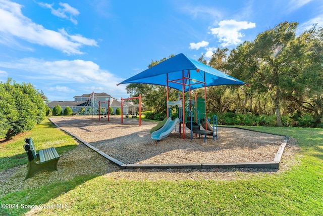 view of playground featuring a yard