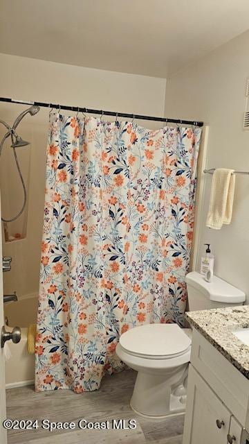 bathroom with hardwood / wood-style floors, vanity, and toilet