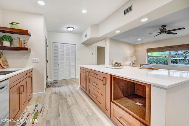 kitchen featuring dishwasher, light wood-type flooring, ceiling fan, and sink