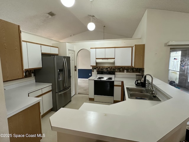 7444 Glenwood Rd, Cocoa, FL 32927 - kitchen with electric range, stainless steel fridge with ice dispenser, under cabinet range hood, a peninsula, and vaulted ceiling