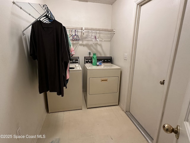 7444 Glenwood Rd, Cocoa, FL 32927 - laundry room with washer and dryer and light flooring