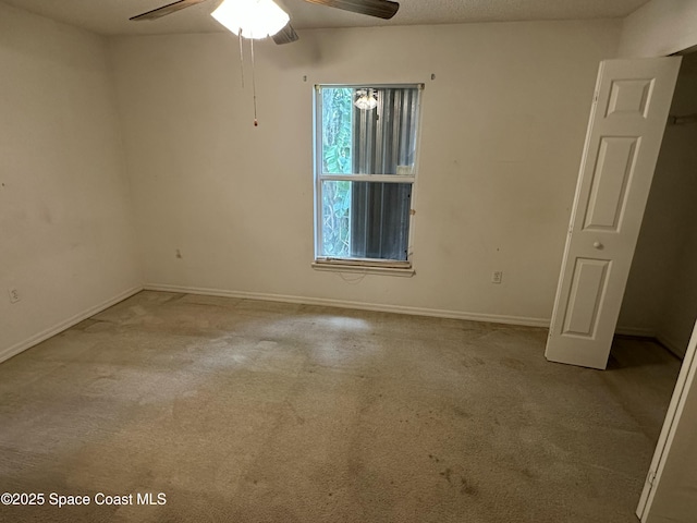 7444 Glenwood Rd, Cocoa, FL 32927 - carpeted empty room featuring a ceiling fan and baseboards