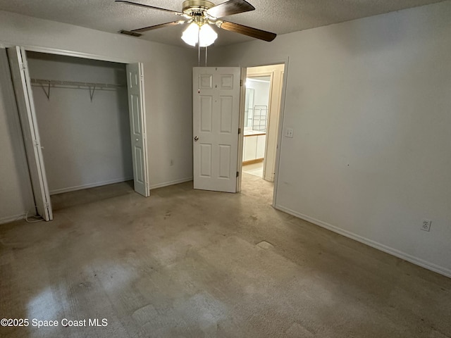 7444 Glenwood Rd, Cocoa, FL 32927 - unfurnished bedroom featuring a textured ceiling, a closet, ceiling fan, and carpet flooring