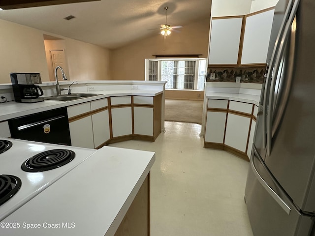 7444 Glenwood Rd, Cocoa, FL 32927 - kitchen with stainless steel refrigerator with ice dispenser, vaulted ceiling, white cabinetry, dishwashing machine, and light countertops