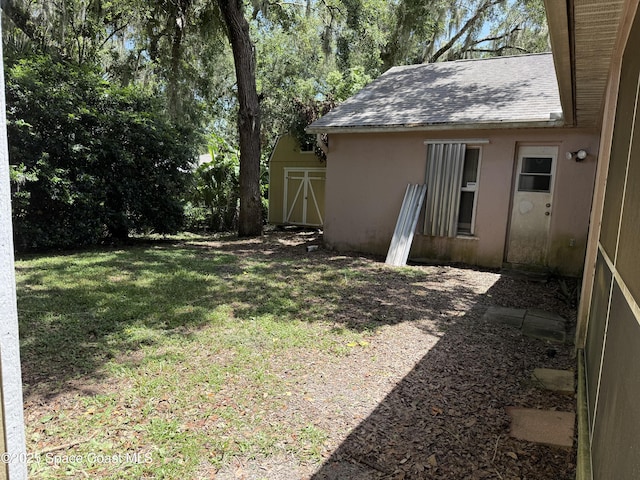 7444 Glenwood Rd, Cocoa, FL 32927 - view of green lawn with a shed