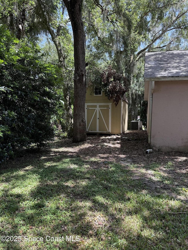 7444 Glenwood Rd, Cocoa, FL 32927 - view of green lawn with a shed