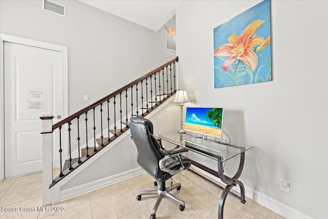 office space with light tile patterned flooring