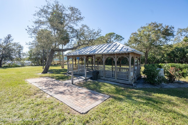 view of home's community with a gazebo and a lawn