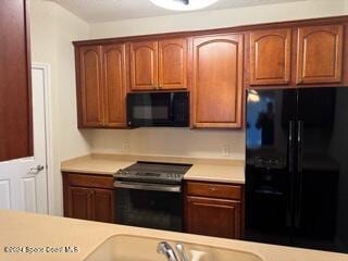 kitchen with black appliances