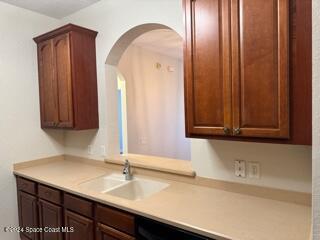 kitchen featuring black dishwasher and sink