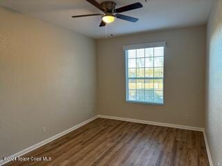 spare room featuring ceiling fan and hardwood / wood-style floors